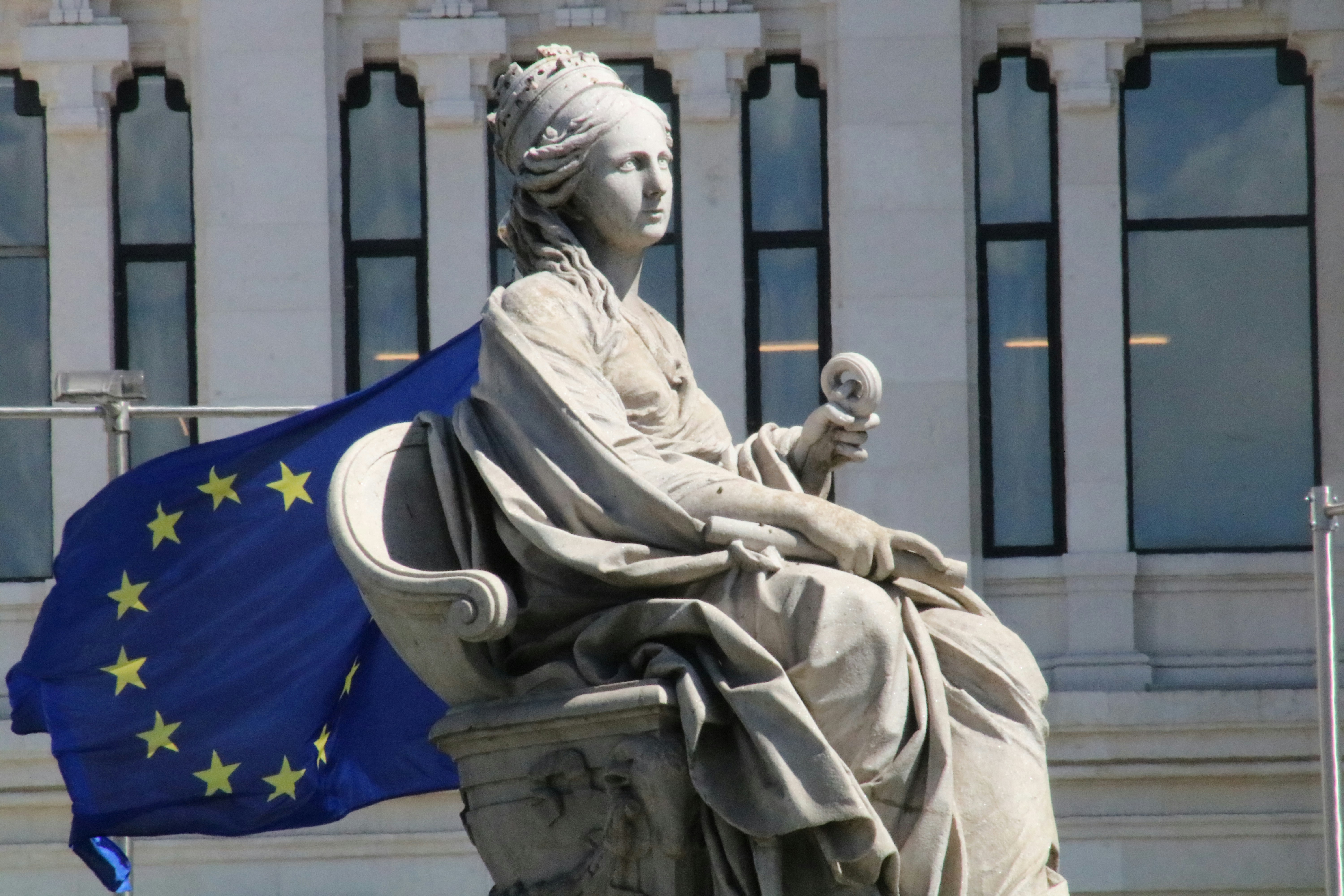 Statue of Europe with EU flag.